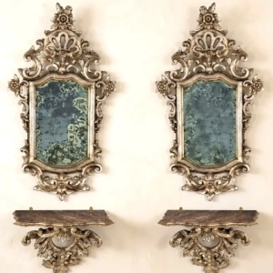 A highly decorative pair of Italian silvered mirrors, with matching consoles, carved openwork of scrolls and flowers. Naples late 18th / early 19th C.