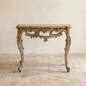 An elegant small Baroque console table. Carved wood with gesso and mecca silver leaf gilding. Originating in the 17th century,