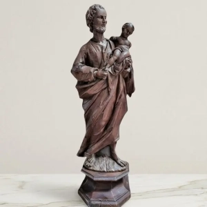 A well carved sculpture of St. Joseph carrying the infant Jesus. The infant Jesus missing both arms and part of one leg. Italian, 19th century.