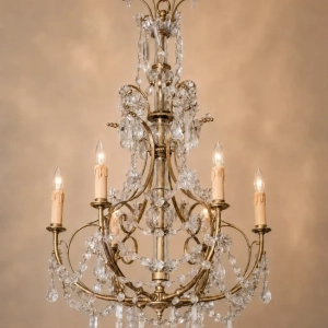 A delicate French chandelier, with star shaped and prism crystals