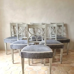 An attractive set of six dining chairs in the Italian Directoire style. Painted soft grey/blue colour with upholstered seats. Italy, early 19th century.