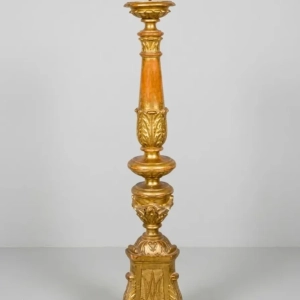 A stunning main altar candlestick in carved and gilded wood