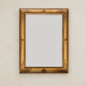 A charming giltwood mirror. Replacement mirror plate. French Empire period, early 19th century.