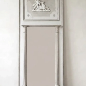 An large painted trumeau mirror with applied decoration. A stucco mythological scene of a stag and cherub. Original mirror plate. France, 19th century.