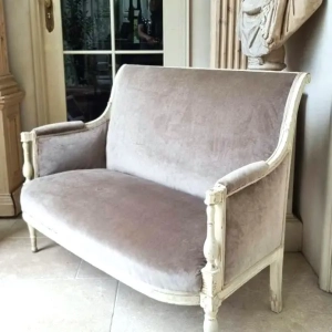 A small directoire style sofa. Modern upholstery with a soft grey velvet. France, late 19th/early 20th century.