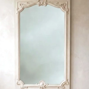 A large, painted Regence style mirror. Decorated with scrolls and shell motifs.