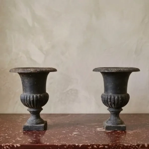 A pair of decorative Medici urns for inside or out. Cast iron.