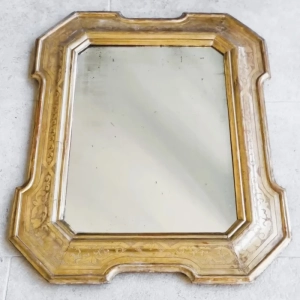 A handsome carved and gilded mirror. The gilding is decorated with burin pierced acanthus leaves, scrolls and curls.