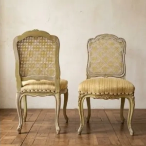 A charming pair of Louis XV provincial style chairs. Featuring carved detail and cane back. France, late 19th, early 20th century.