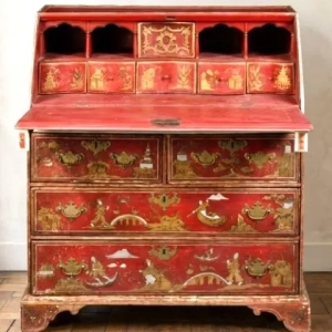 An exceptional desk in lacquered and gilded wood, decorated with Chinese scenes. Opening to reveal six drawers, four niches and a secret compartment. England, 18th century