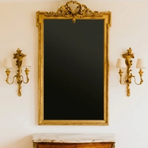 A striking Louis XVI style mirror with ribbon decoration cresting. France, late 19th/early 20th century.