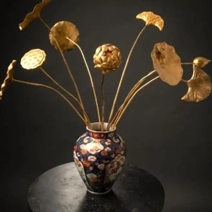 A glorious collection of carved and gilded wooden lotus stems. Repair to one stem. Japan, early 20th century.