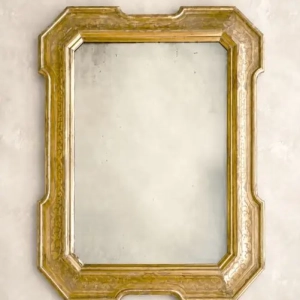 A handsome carved and gilded mirror. The gilding is decorated with burin pierced acanthus leaves, scrolls and curls. Italy, 19th century.