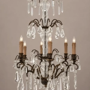 A delicate French chandelier, with a variety of crystals