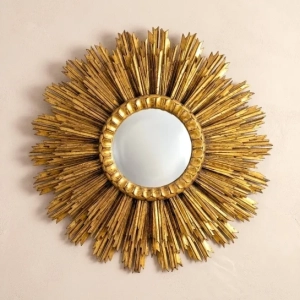A striking gilt wood sunburst mirror